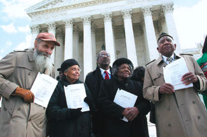 This image shows a March 10, 2005 photograph of L–R Robert Holloway, Anita Holloway, Thelma Thurman Knight, and Otis Clark as they held copies of a legal brief filed by Harvard law professor Charles Ogletree